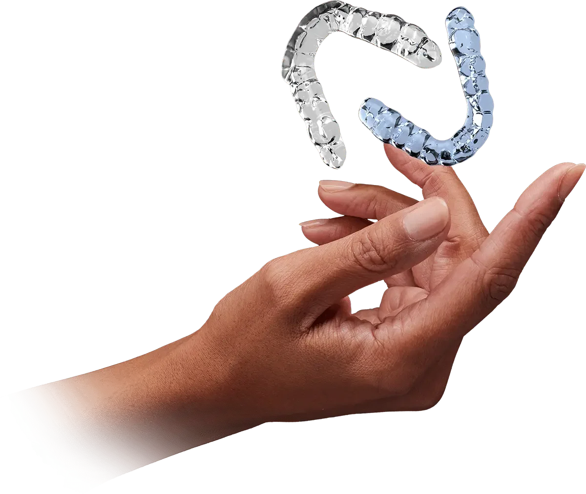A hand holding a clear Invisalign retainer with a second one floating above it.