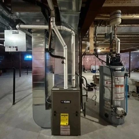 Basement with HVAC systems, pipes, and ductwork