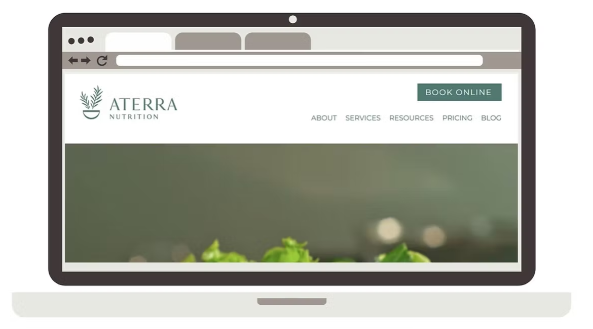 A laptop screen displaying a website for Aterra Nutrition with menu options and a green 'Book Online' button in the header.