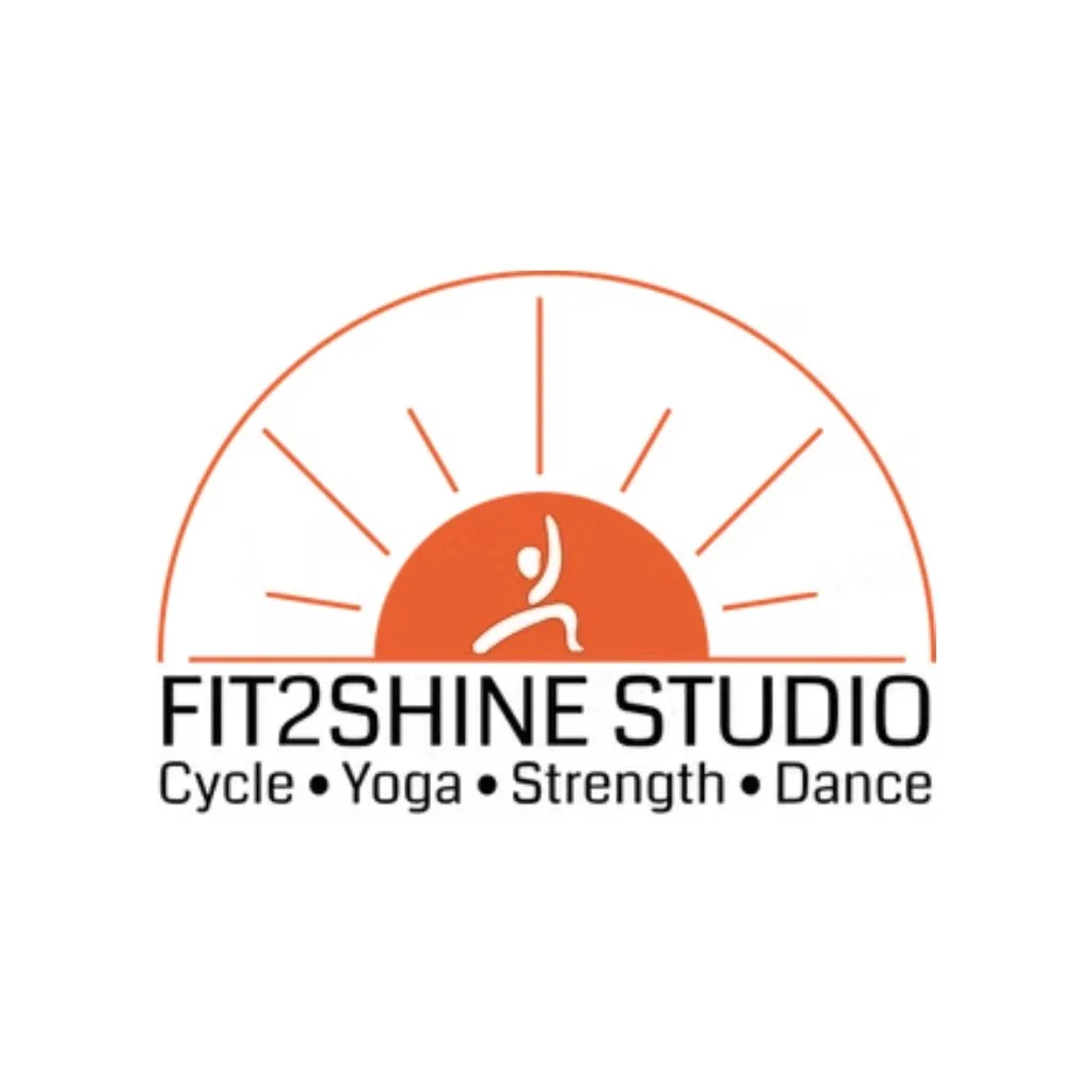 Logo for Fit2Shine Studio featuring a stylized person in a yoga pose with radiating lines resembling a sunrise, and text indicating it offers cycle, yoga, strength, and dance classes.