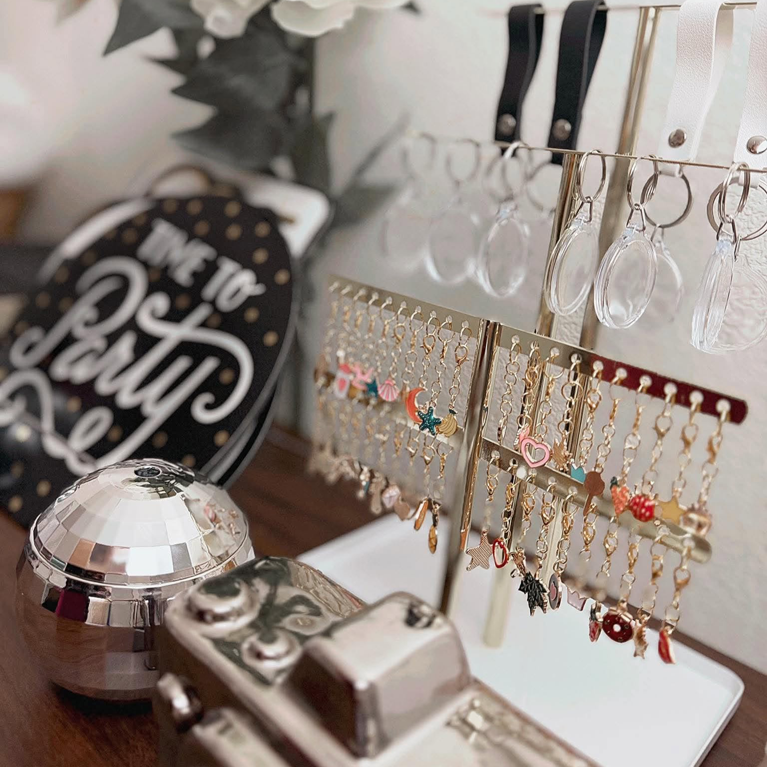 Fun and Interactive keychain station with tiered displays of colorful charms where guests create personalized keepsakes at events.