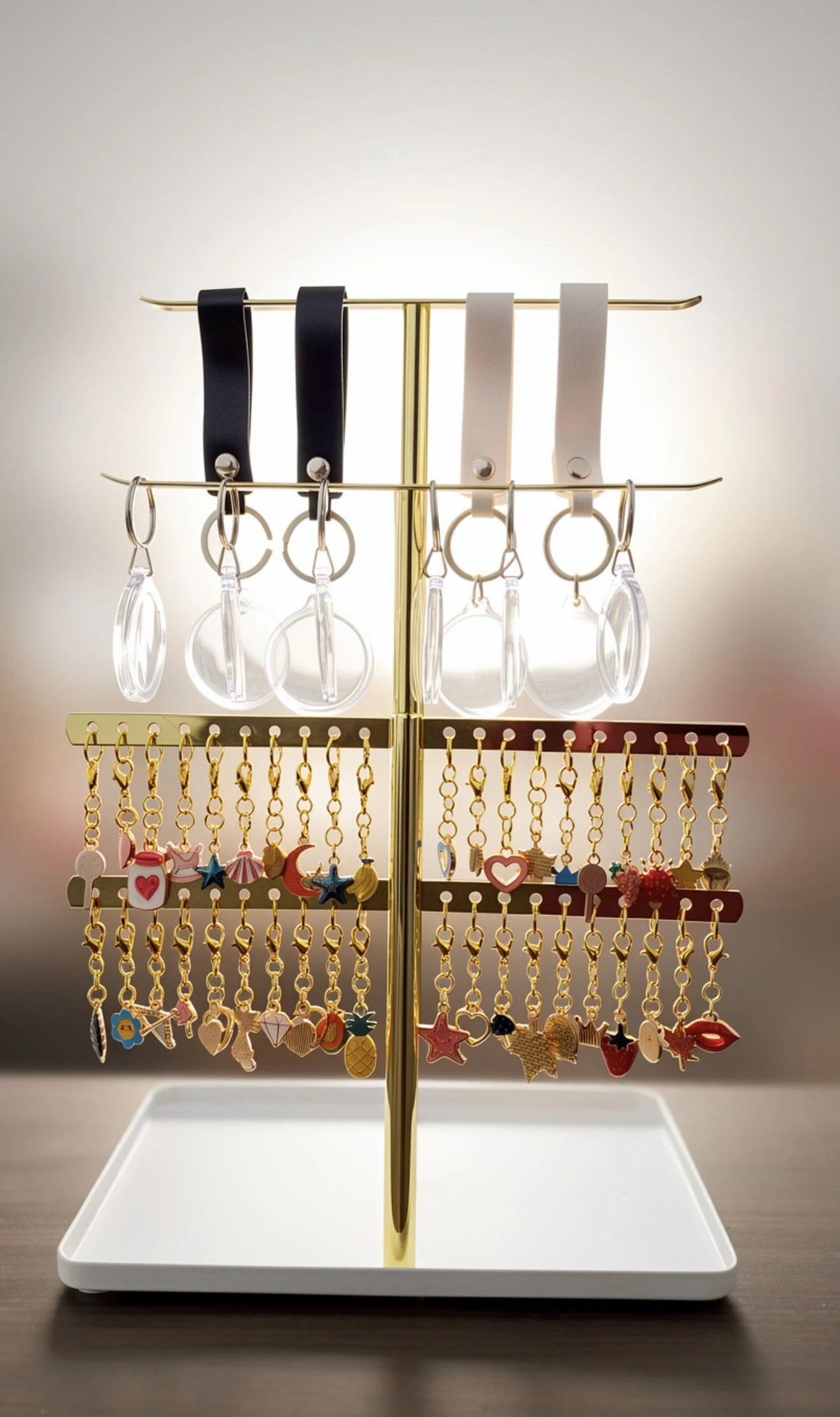 Dreamy DIY keychain station with tiered displays of colorful charms, inviting guests to create personalized keepsakes.