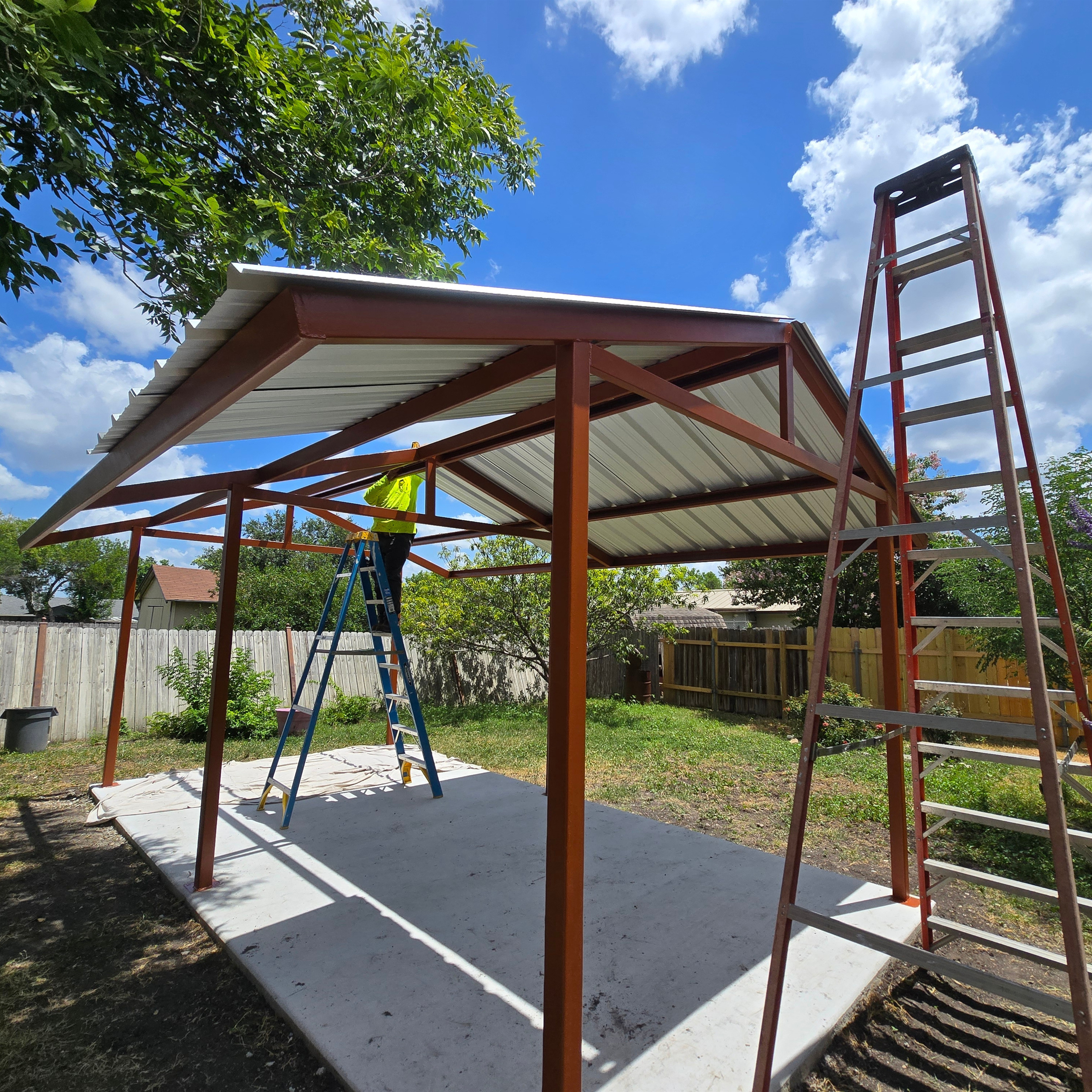 A residential project welding onsite with a custom steel gazebo frame.