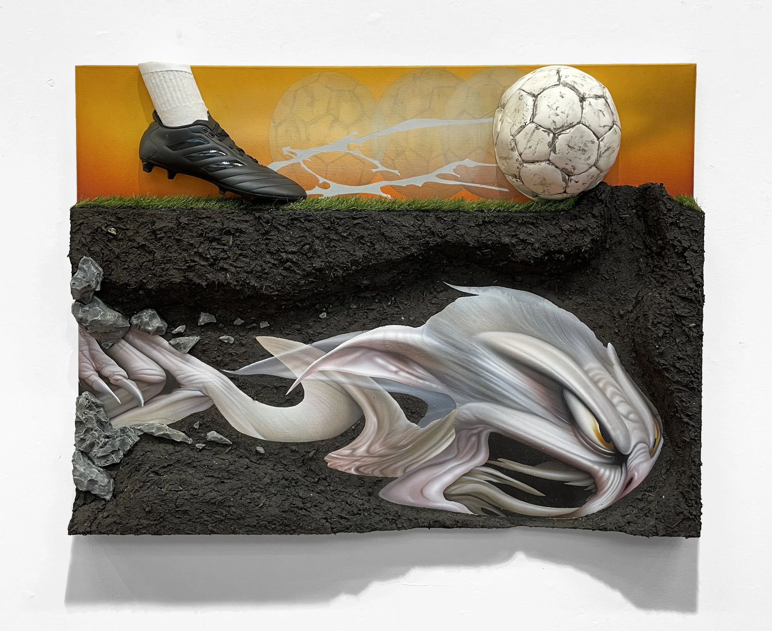 “Maximal Running Speeds of Bipedal Rodents”, 2024, acrylic, expandable foam, mud, polystyrene foam board, cardboard, artificial turf, leather football shoe, football, epoxy, sock, polyfilla, roots, and sand on linen canvas, 102 x 78 x 12 cm, 40.2 x 3