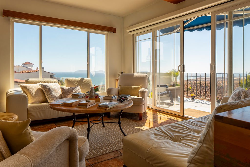 Lounge area near kitchen overlooking ocean view near porch / balcony at The Mission Within retreat