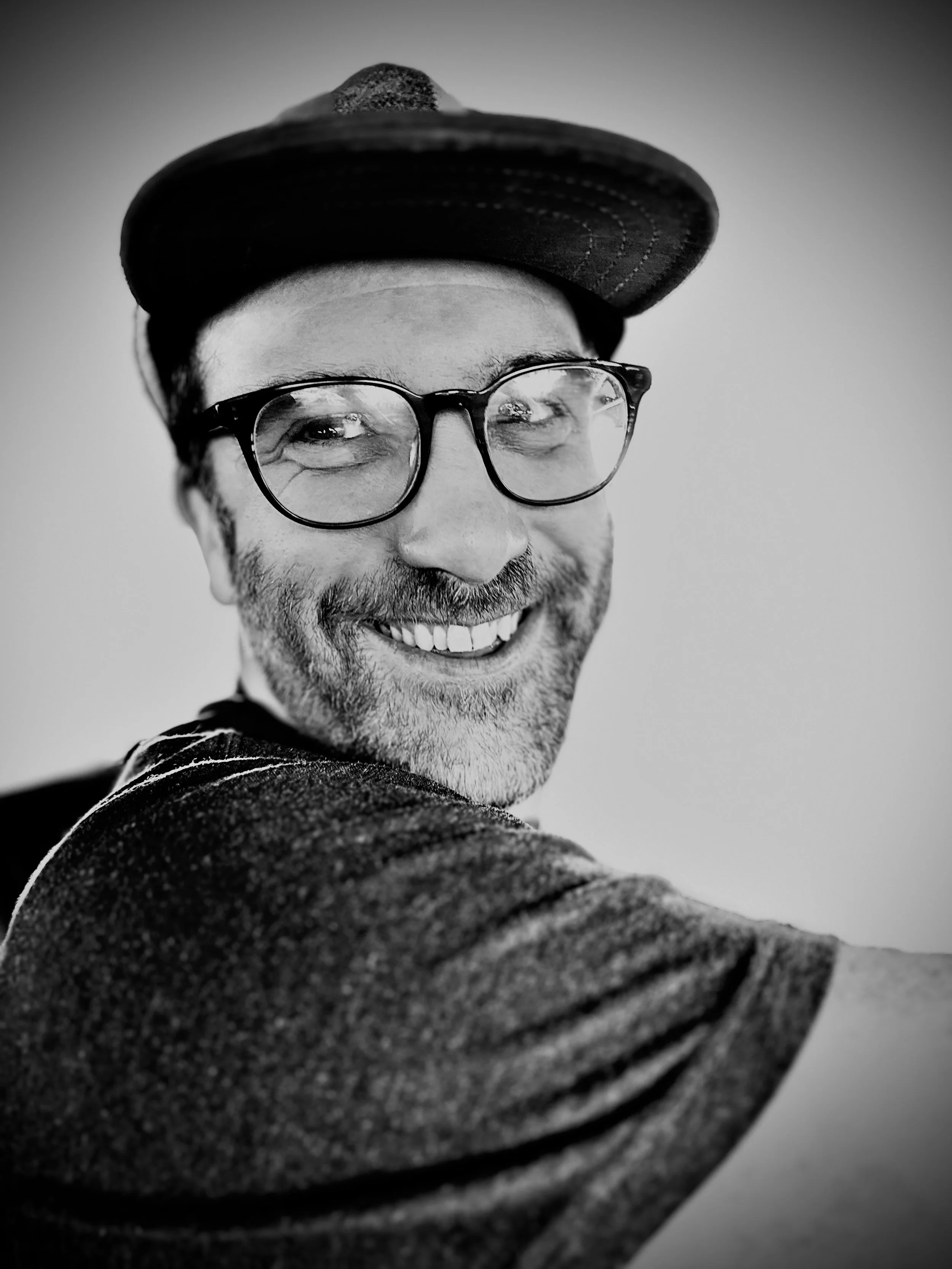 A black and white close-up photo of John Petrina.