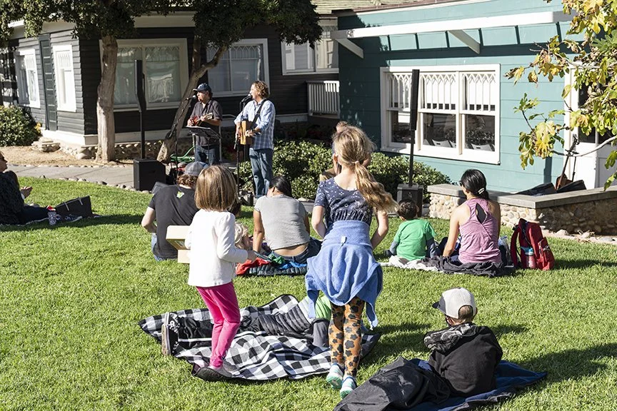 Hullabaloo performance on lawn with families dancing