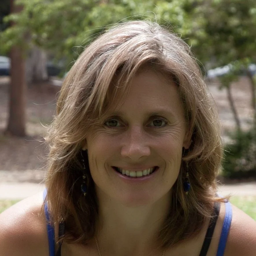 woman with short hair smiling