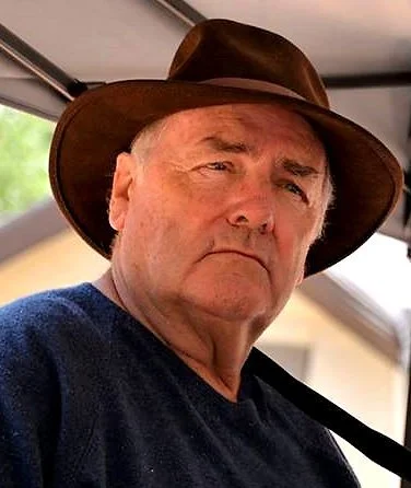 man in brown hat and navy blue shirt