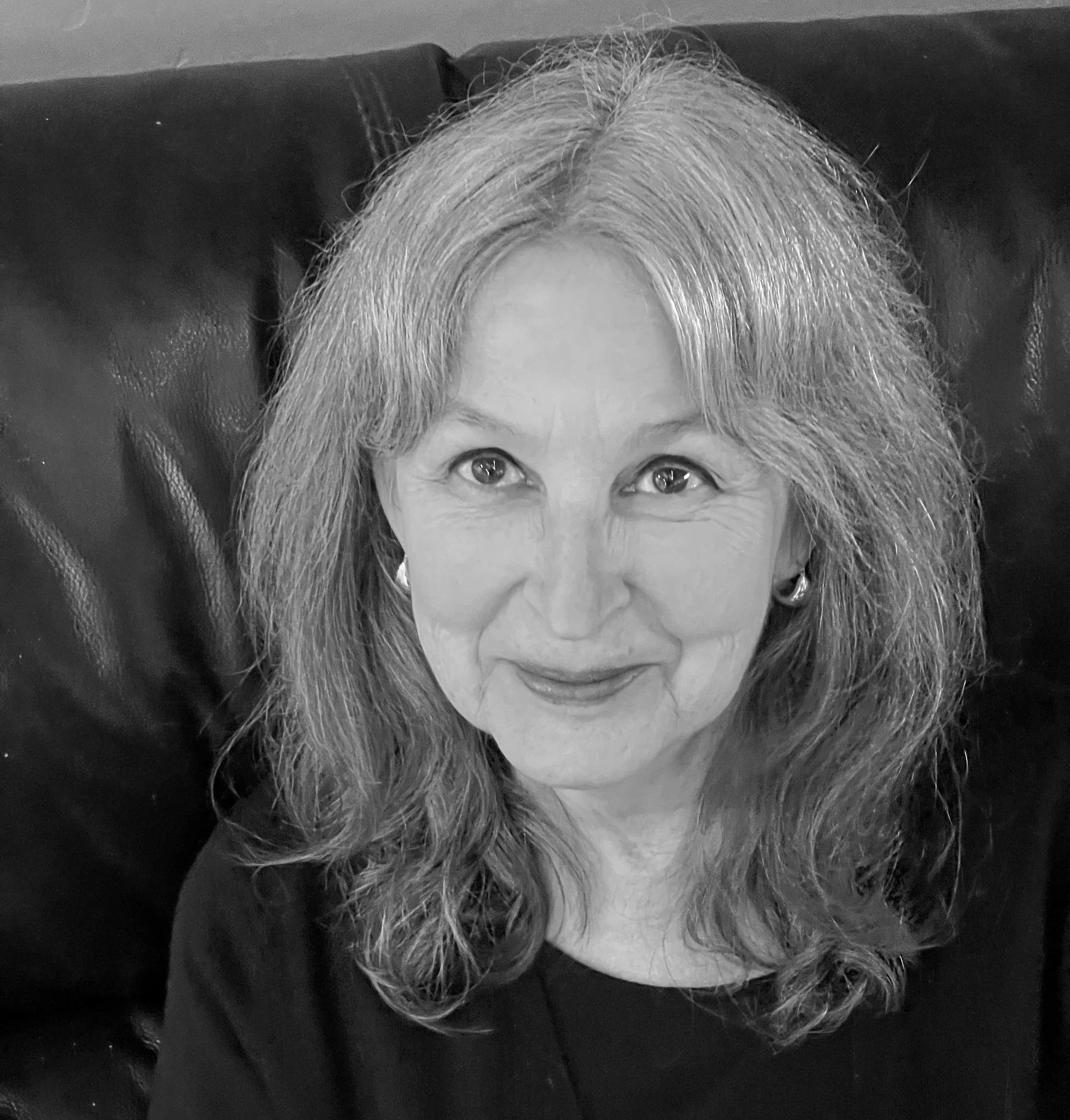 black and white photograph of a smiling older woman