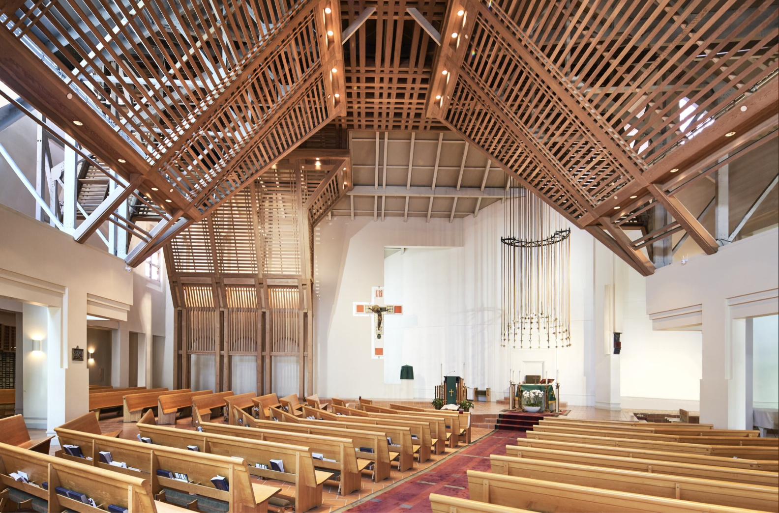 Photography by Maha Bazzari (2024) Interior of the Church of the Nativity by architect Charles Moore features beautiful wood beams, a 500 year old crucifix from Mexico City