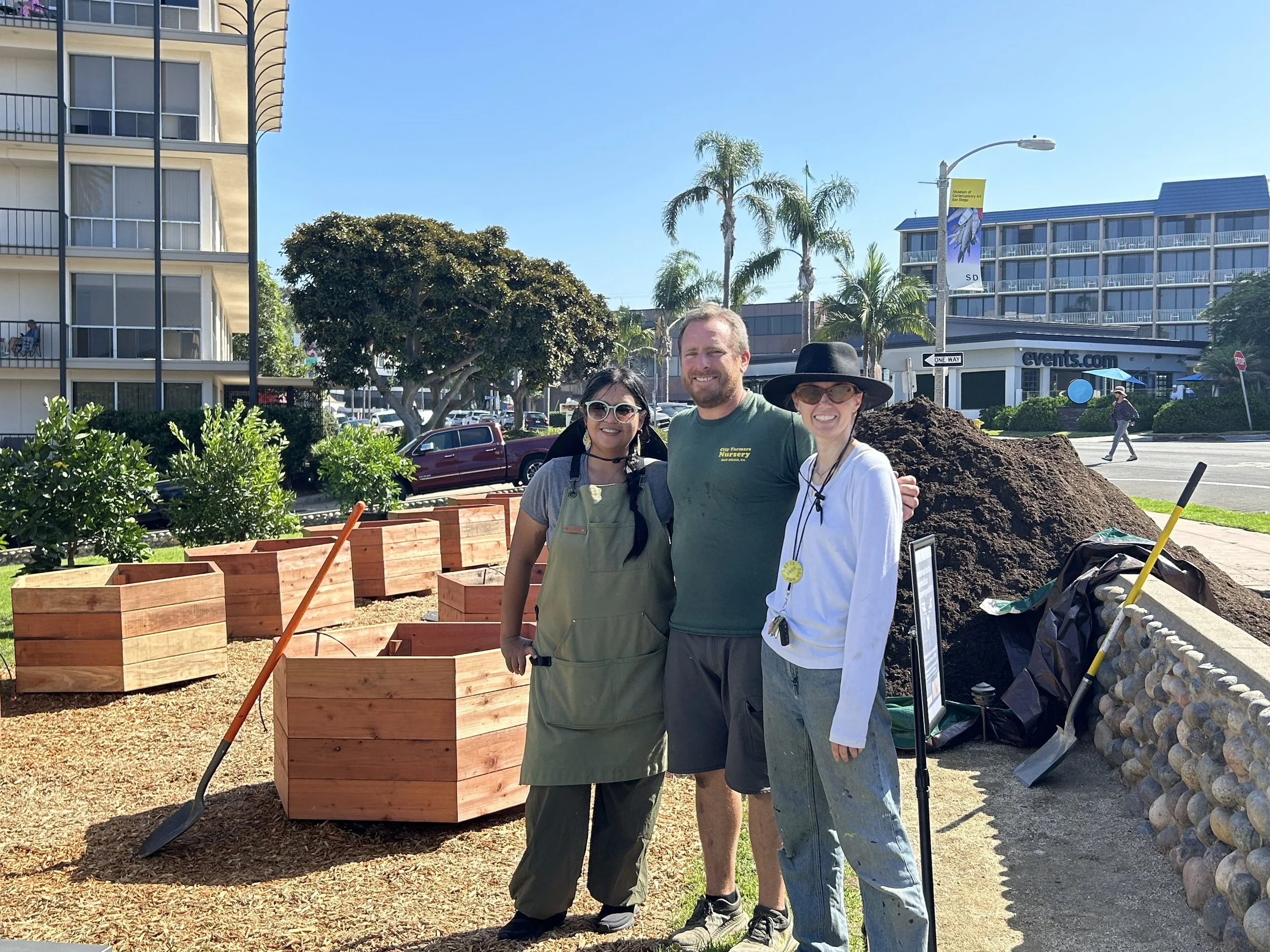 Horticulturist Carla Quimson, City Farmers Nursery Owner Sam Tall, and project manager McKenna Clifford Yahyai stop to admire months of conversations turned into a reality! 