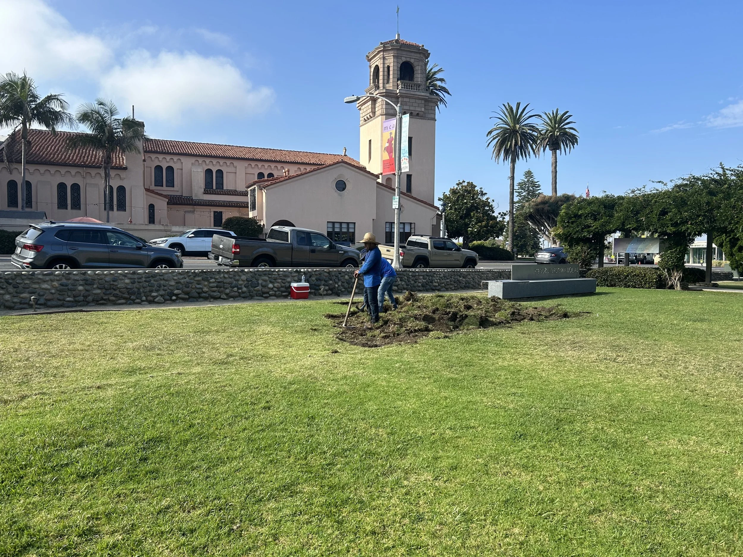 Juan Carlos and Antonio of Juan Carlos Lawn Care starting to remove the sod