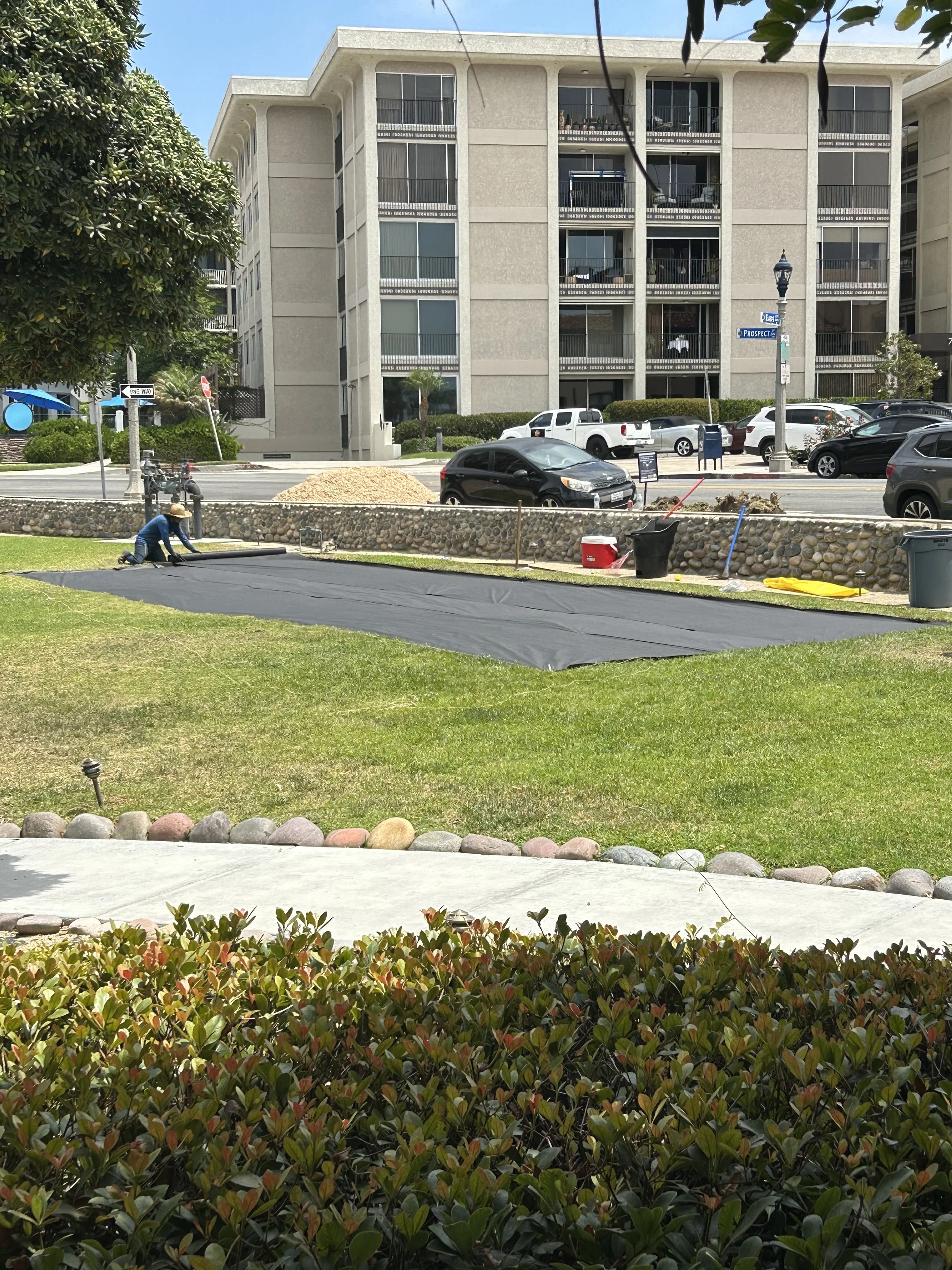 Antonio of Juan Carlos Lawn Care preps the site for mulch