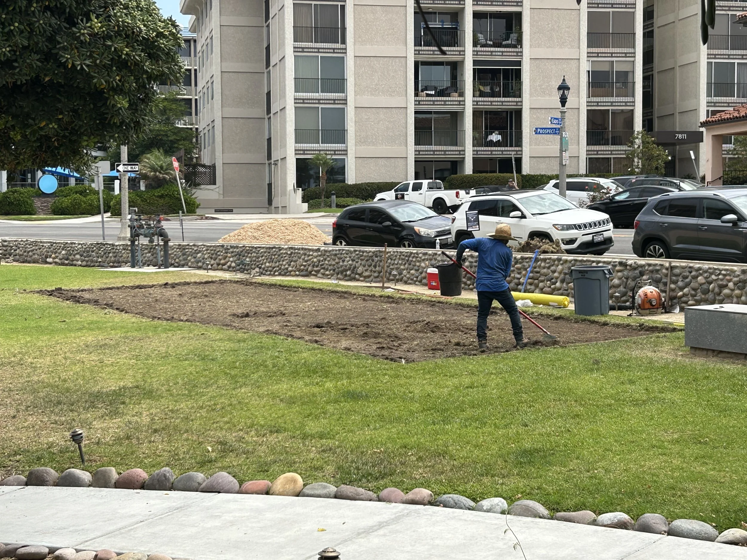 Antonio of Juan Carlos Lawn Care, leveling out installation site. 