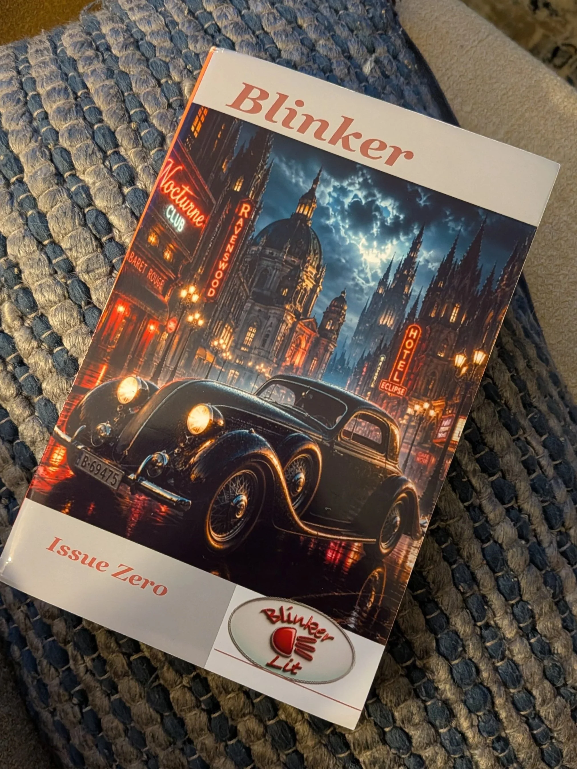 Photo of Blink Lit Issue Zero with a black old car in front of a cityscape