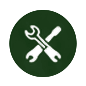 Icon of a wrench and screwdriver crossed over each other on a green circular background.
