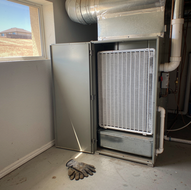 Mold on damp evaporator coil inside AC unit