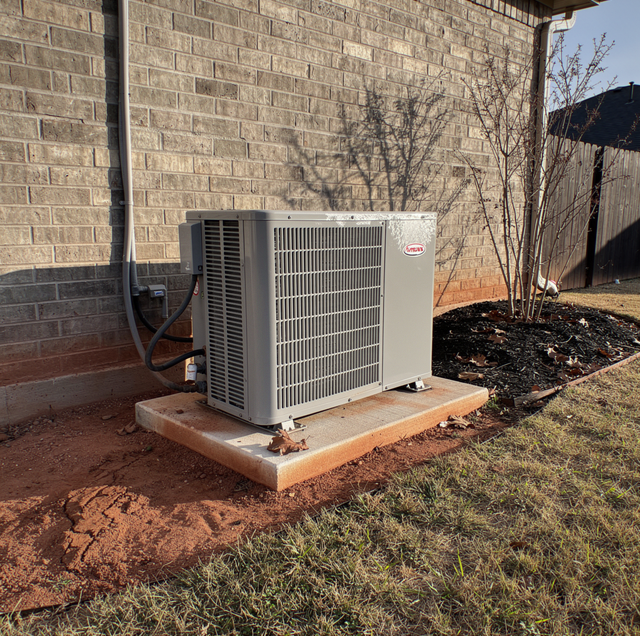ice covered outdoor heat pump unit in Dallas