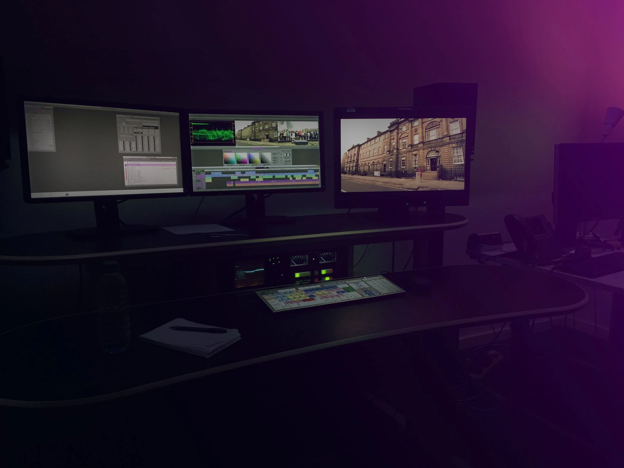 A picture of an edit suite with 3 monitors