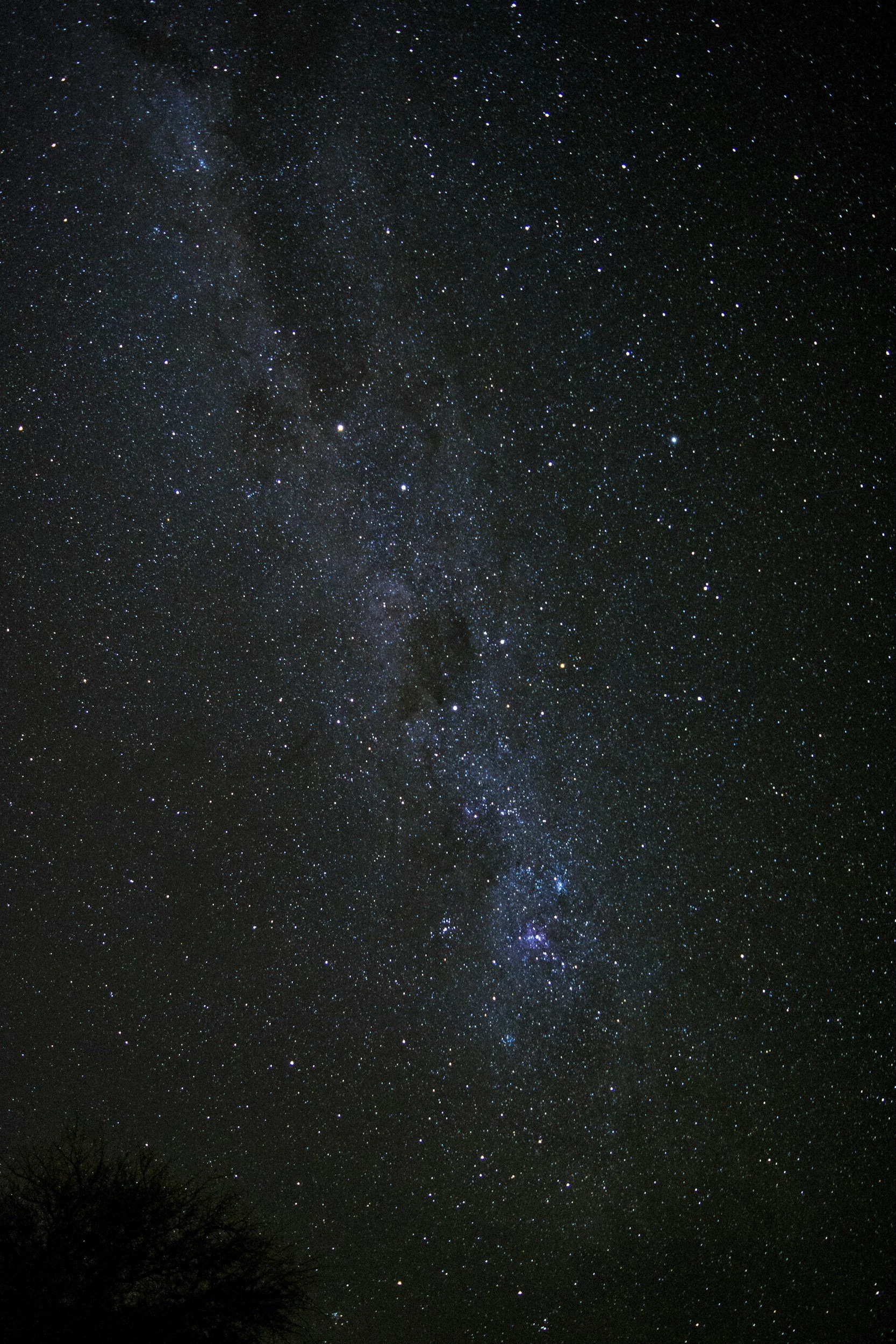 The Milky Way stretching across a dark sky filled with stars above the Atacama Desert.