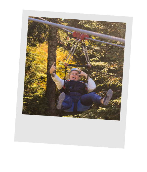 Piper Eskridge ziplining through the treetops on Grouse Mountain near Vancouver, British Columbia