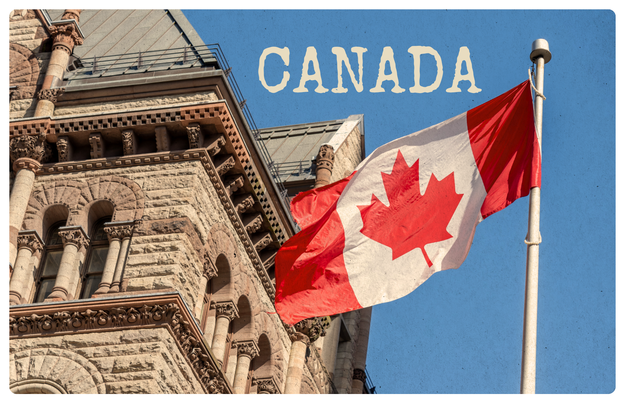 Canadian flag flying beside a historic sandstone building in Toronto, Ontario
