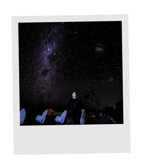 Piper, founder of Tern & Meridian, standing beside telescopes beneath the Milky Way in the Atacama Desert.