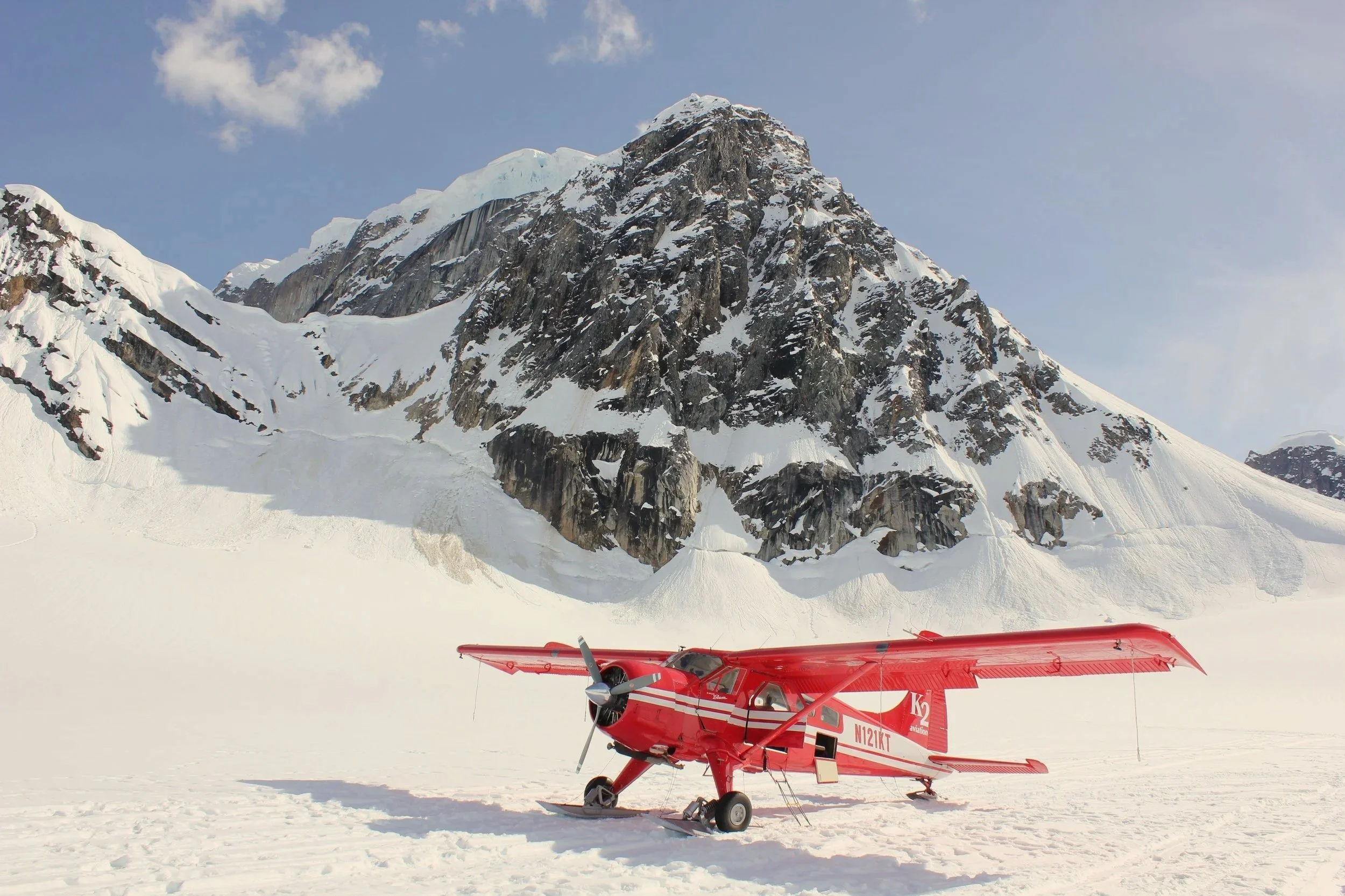 Ski plane on the Ruth Glacier beneath the peaks of Denali National Park, Alaska
