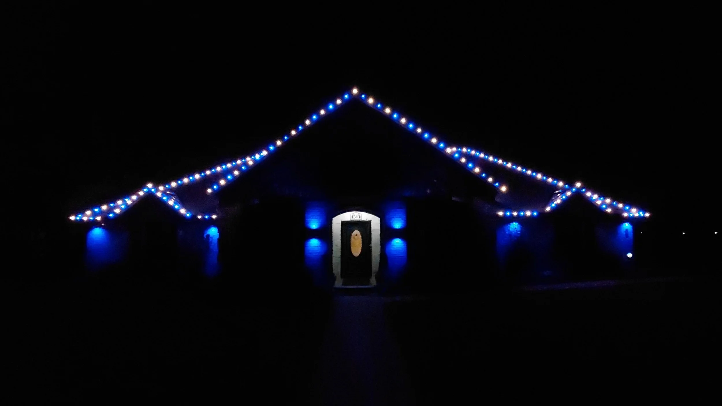 All-blue Christmas roofline and accent lighting installation on a home, Double Oak TX