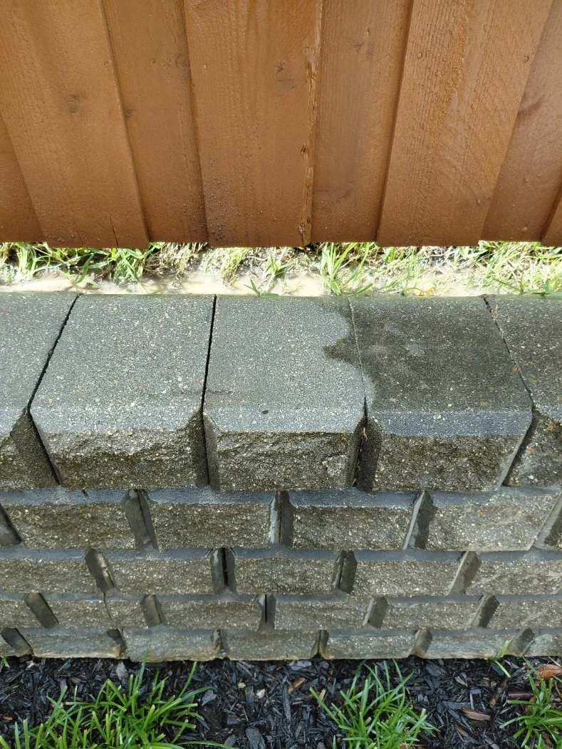 The difference is night and day - partially pressure washed retaining wall in Grapevine