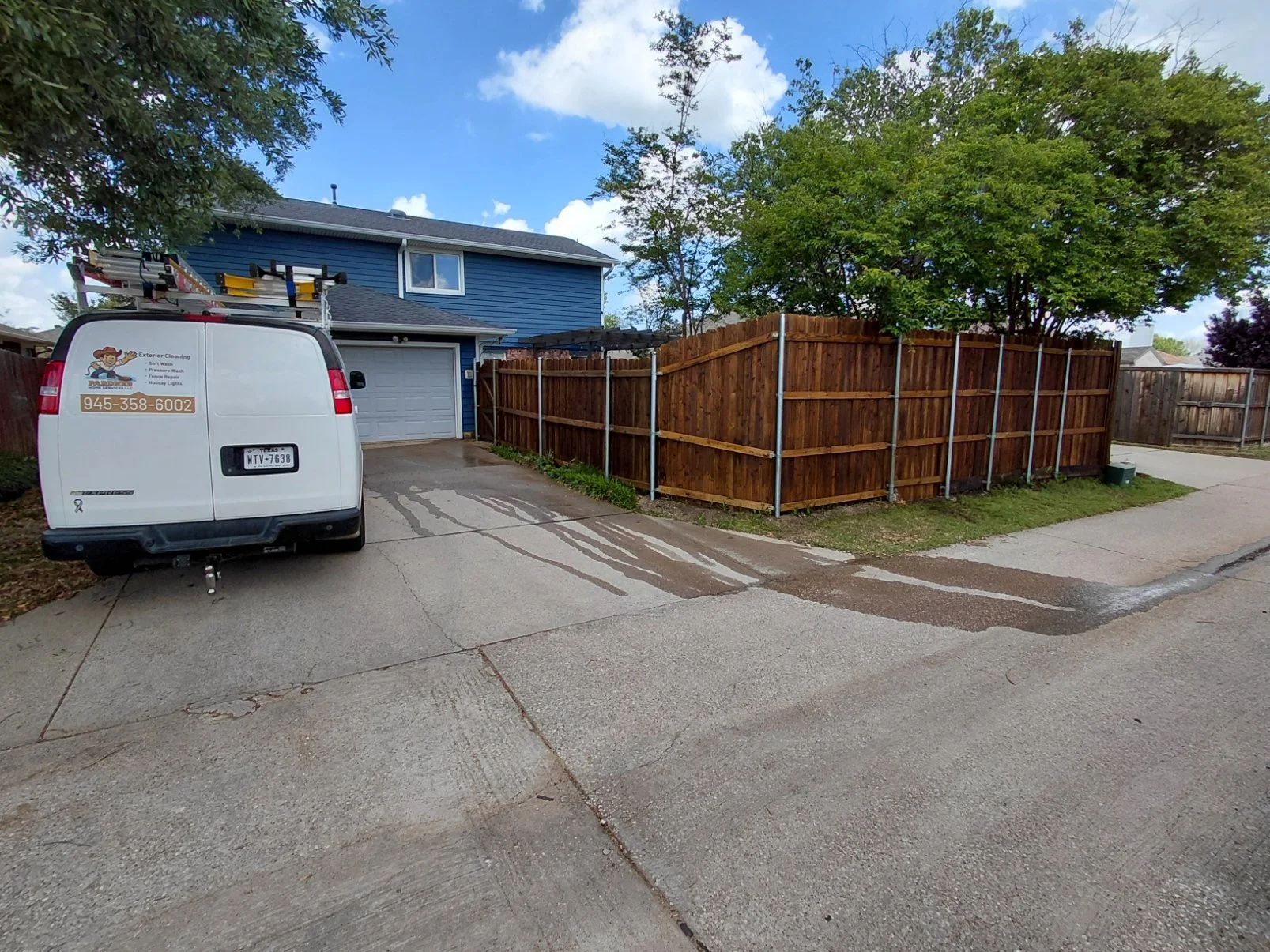 Work van on site at customers home - pressure washed and stained fence in Flower Mound