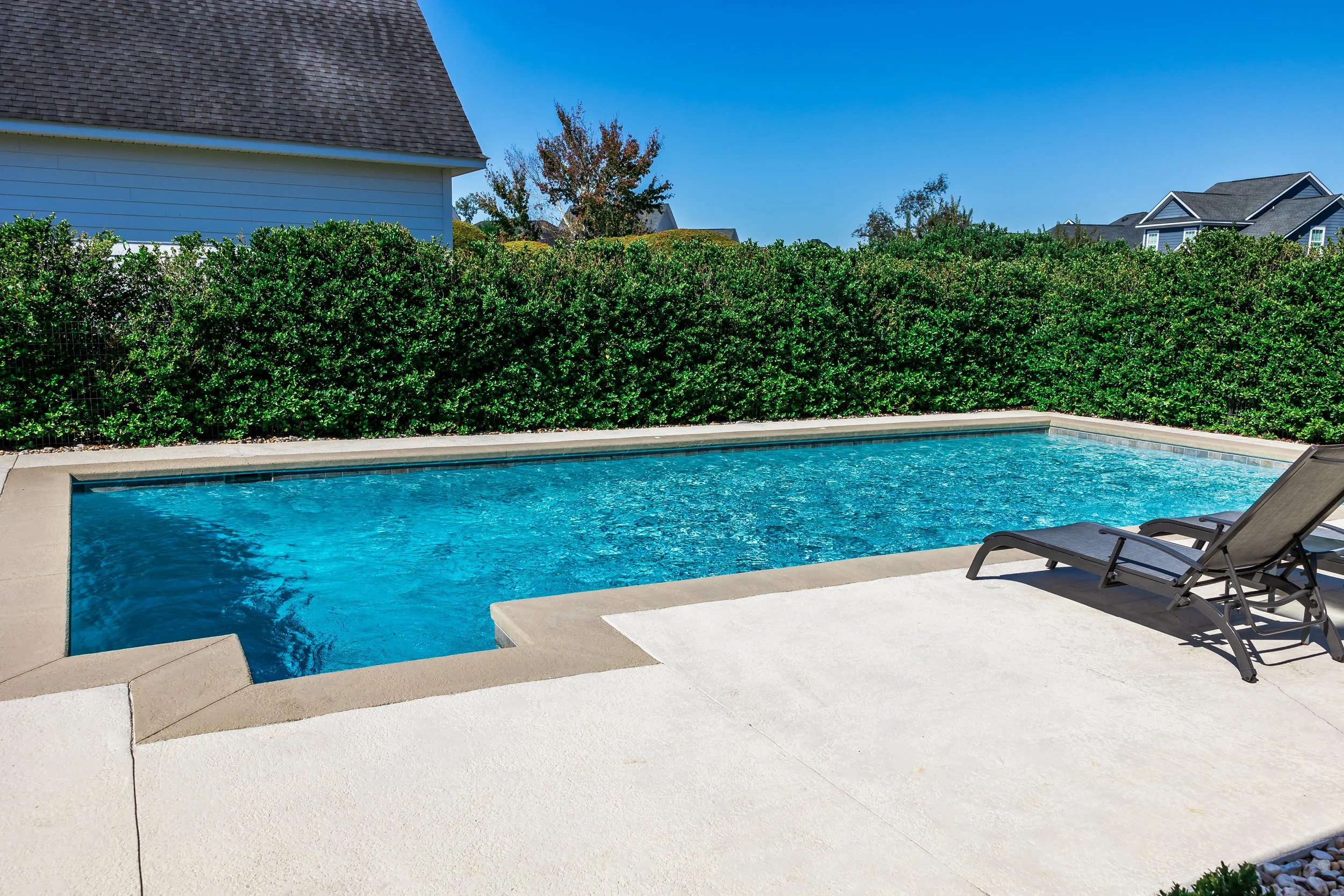 Freshly cleaned pool deck and coping.