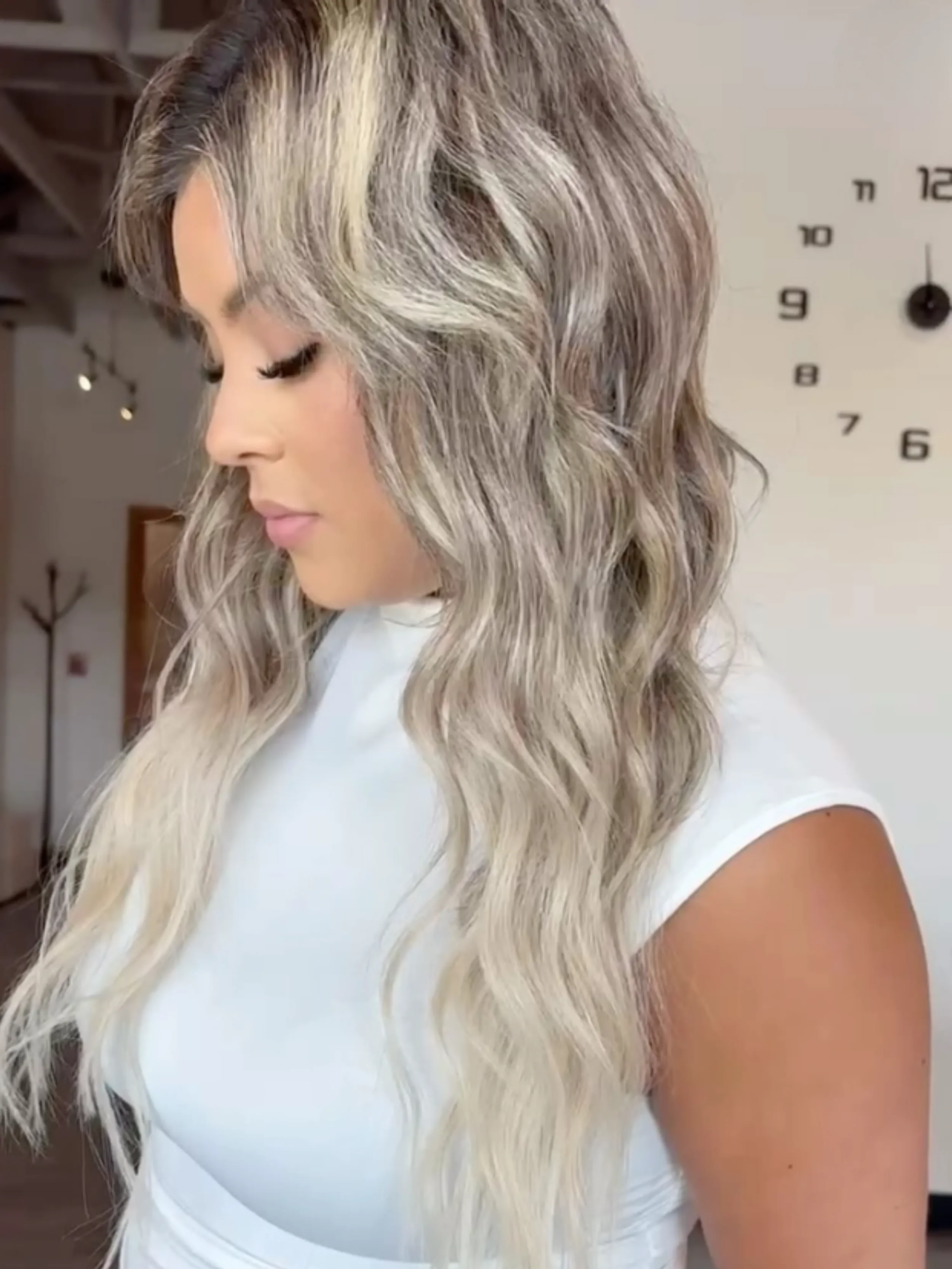 Sleek icy blonde balayage on long hair, side view — cool-toned blonde at Itsa Salon in Puyallup, WA 3