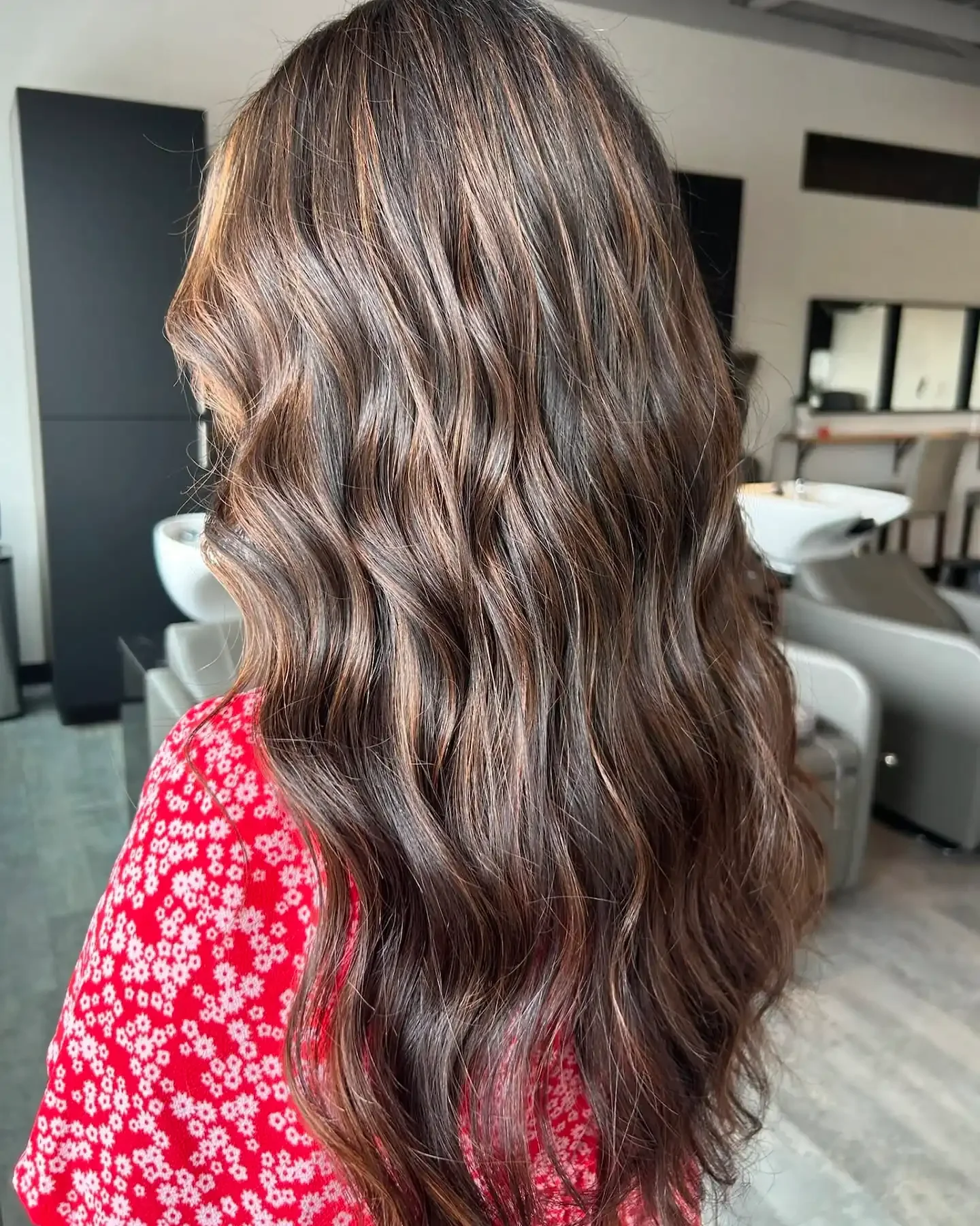 Warm chestnut brunette waves with soft dimension — brunette balayage at Itsa Salon in Puyallup, WA