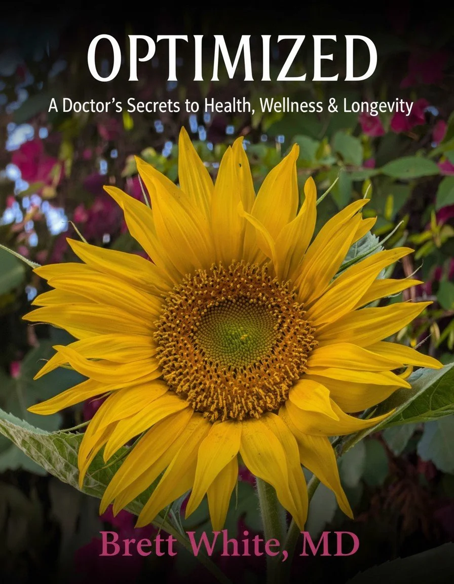 Cover of a book titled 'Optimized: A Doctor's Secrets to Health, Wellness & Longevity' with a close-up of a sunflower in full bloom.