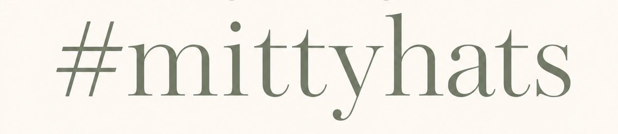 Text that reads '#mittyhats' in a simple font on a plain background.