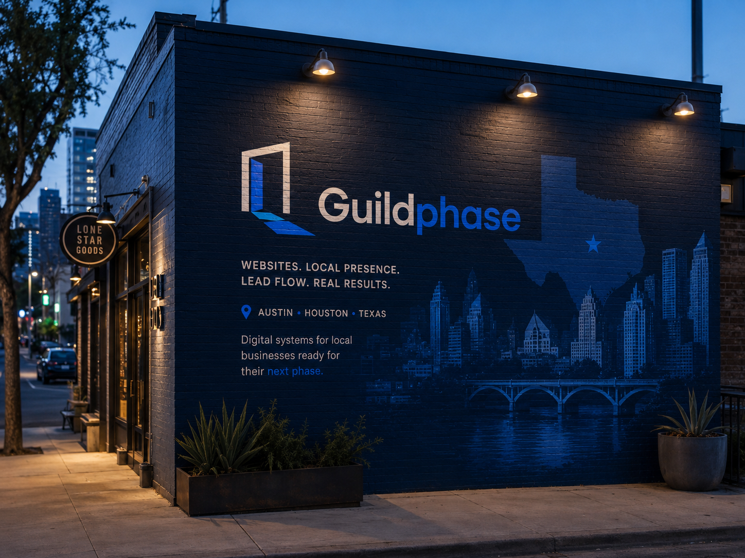 A mural on a building wall promoting Guildphase, a digital marketing company in Austin, Texas, showing a city skyline silhouette and text about digital systems for local businesses.