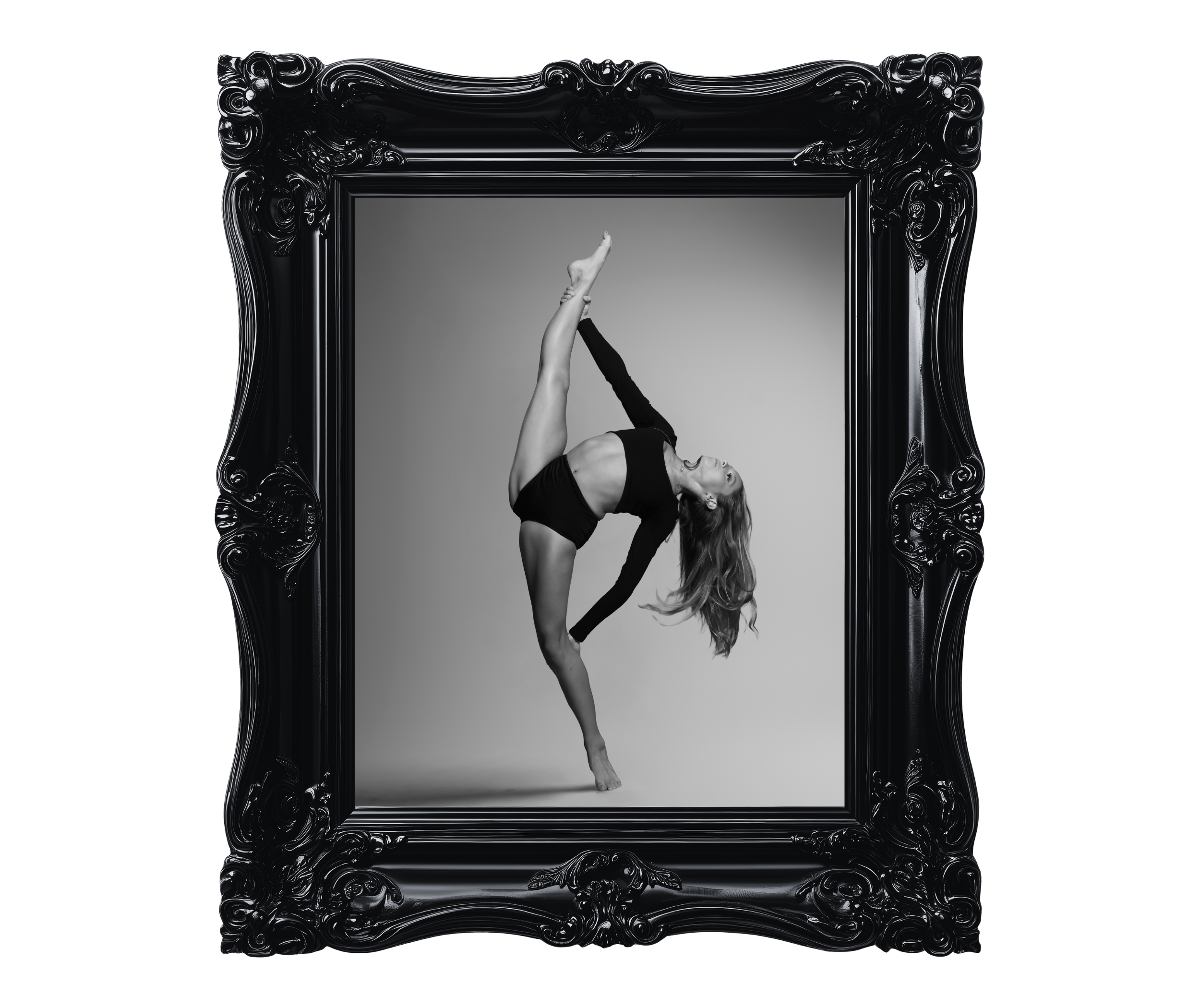 A woman performing a dance pose inside an ornate black frame with a mirror reflecting her gray background.
