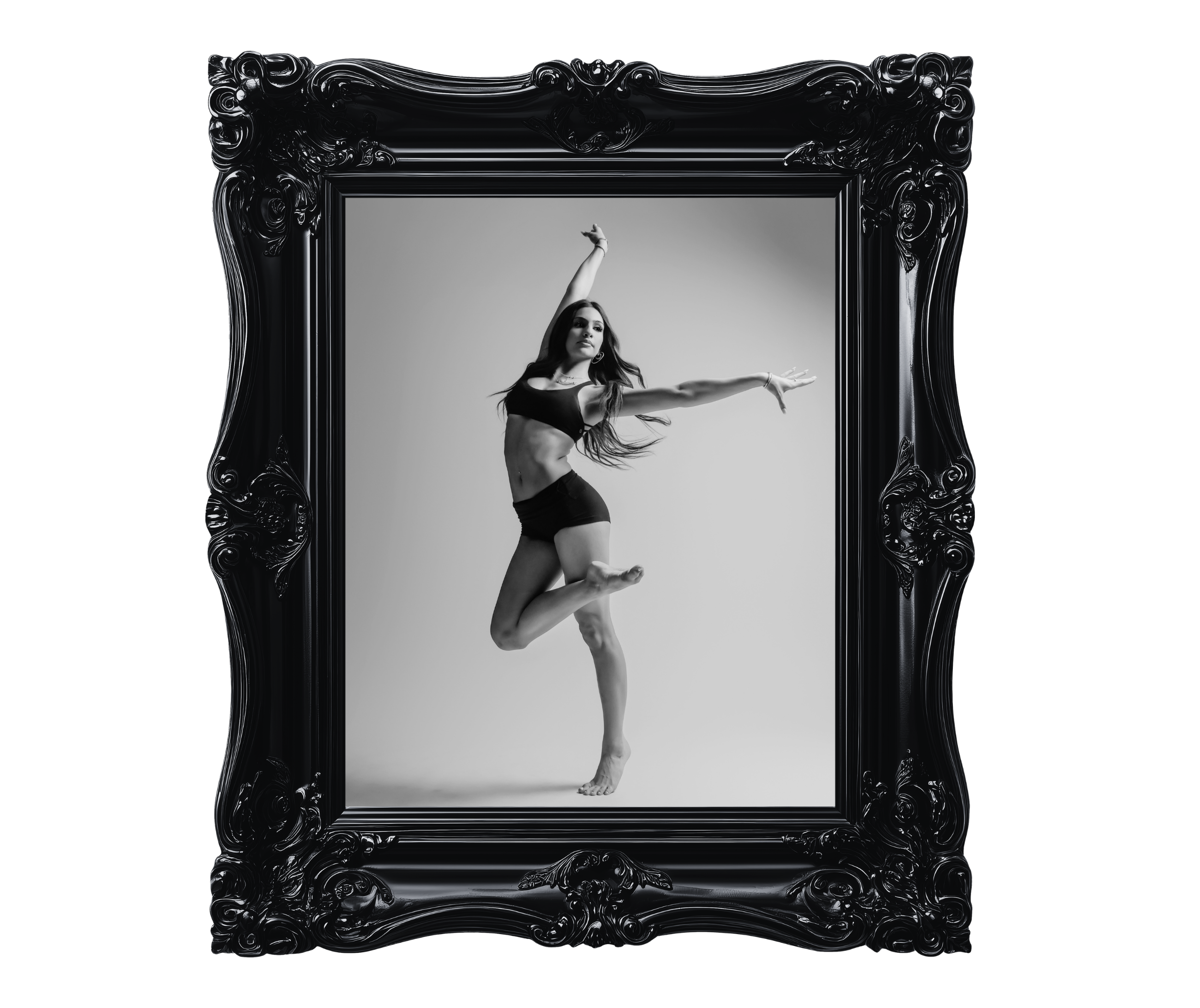 A woman in black workout clothes performing a yoga pose inside an ornate black frame, with a gray background.