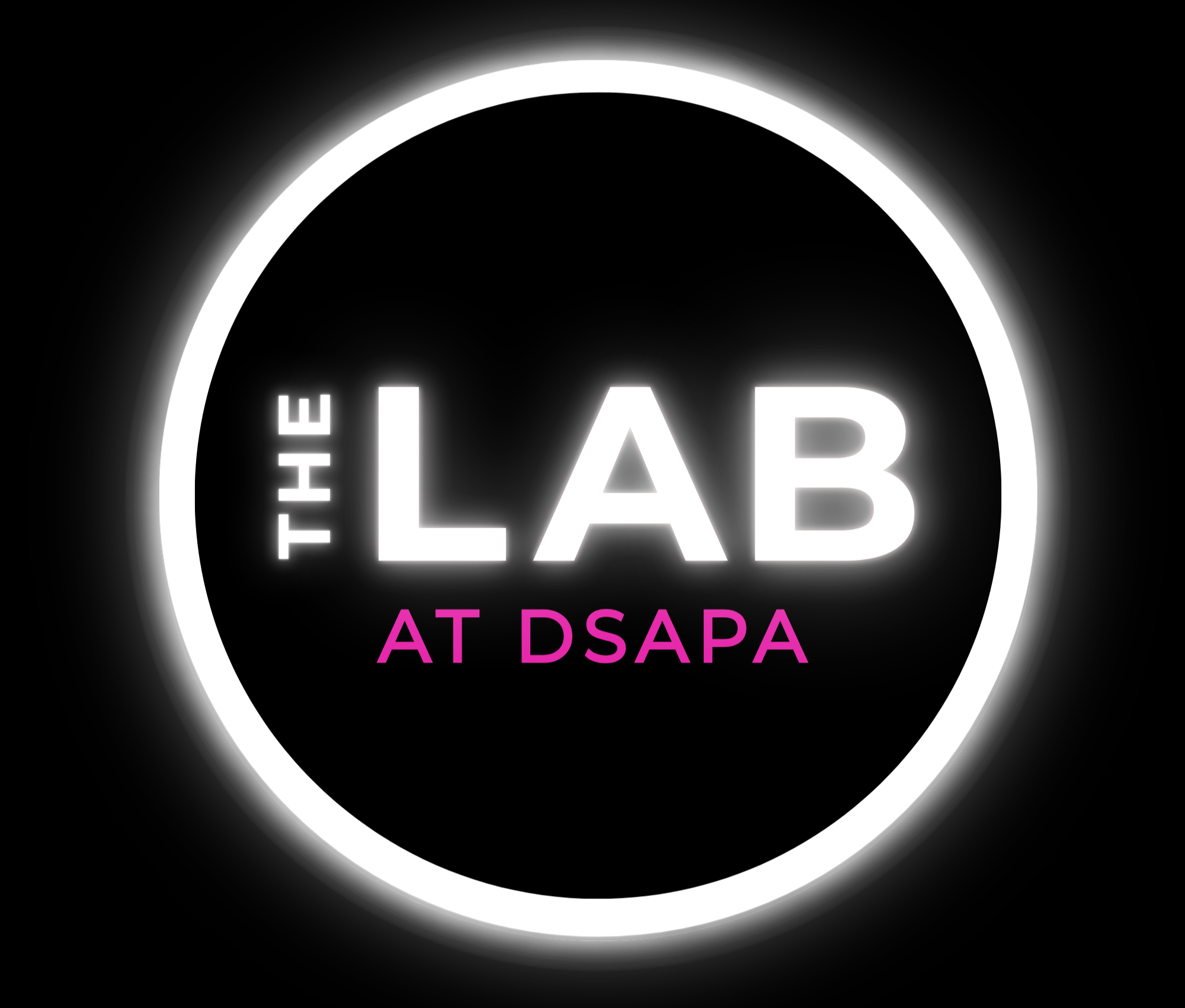 Neon sign with a black background and glowing white circle, displaying text in white and pink that reads 'THE LAB AT DSAPA'.