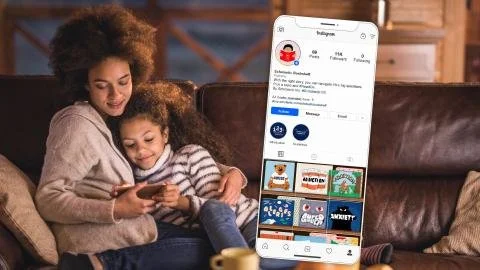 A woman and a young girl are sitting on a couch, looking at a smartphone together, with a large phone screen displaying an Instagram profile in the foreground.
