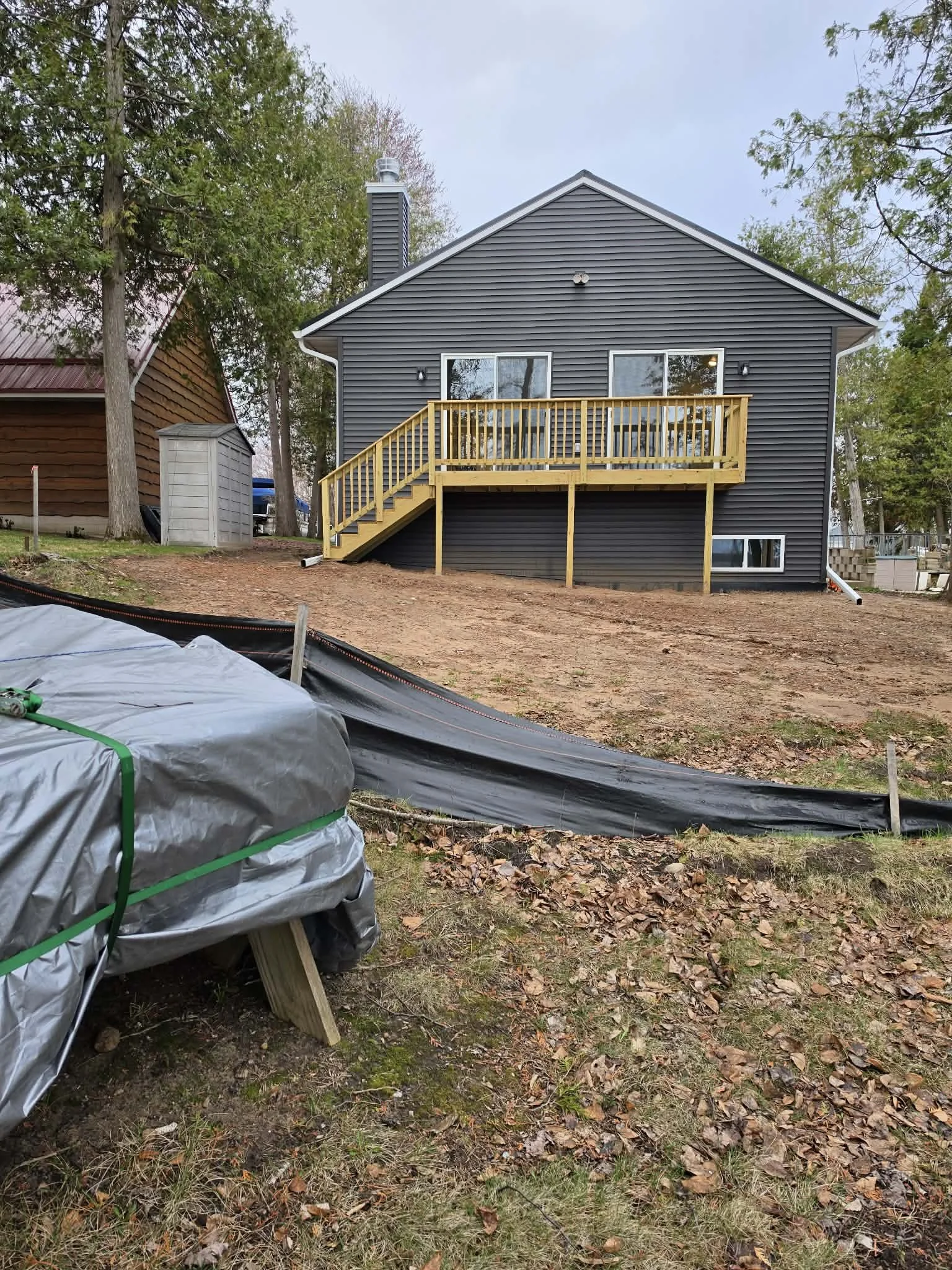 Landscape prep — Lakefront property ground prep and lawn work in progress by Ground & Grid Solutions