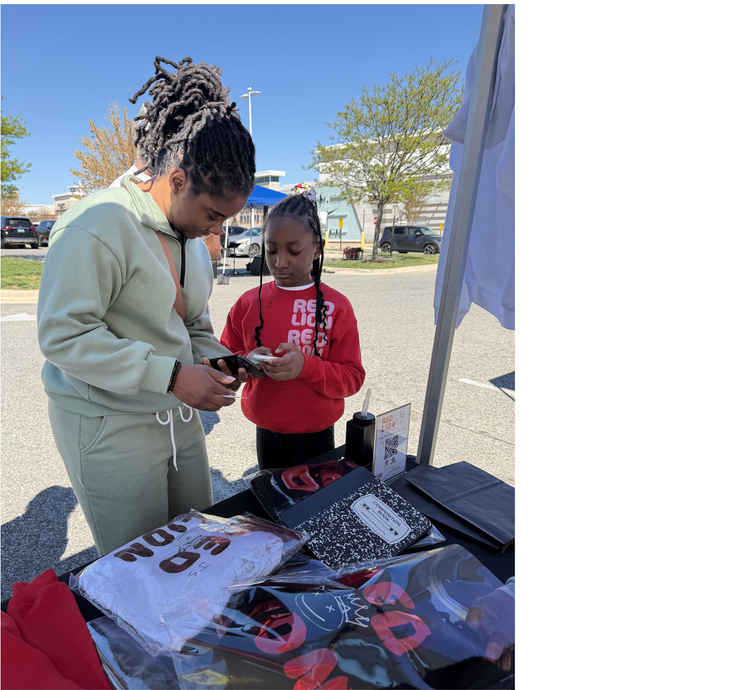 Students selling products at a youth pop-up shop