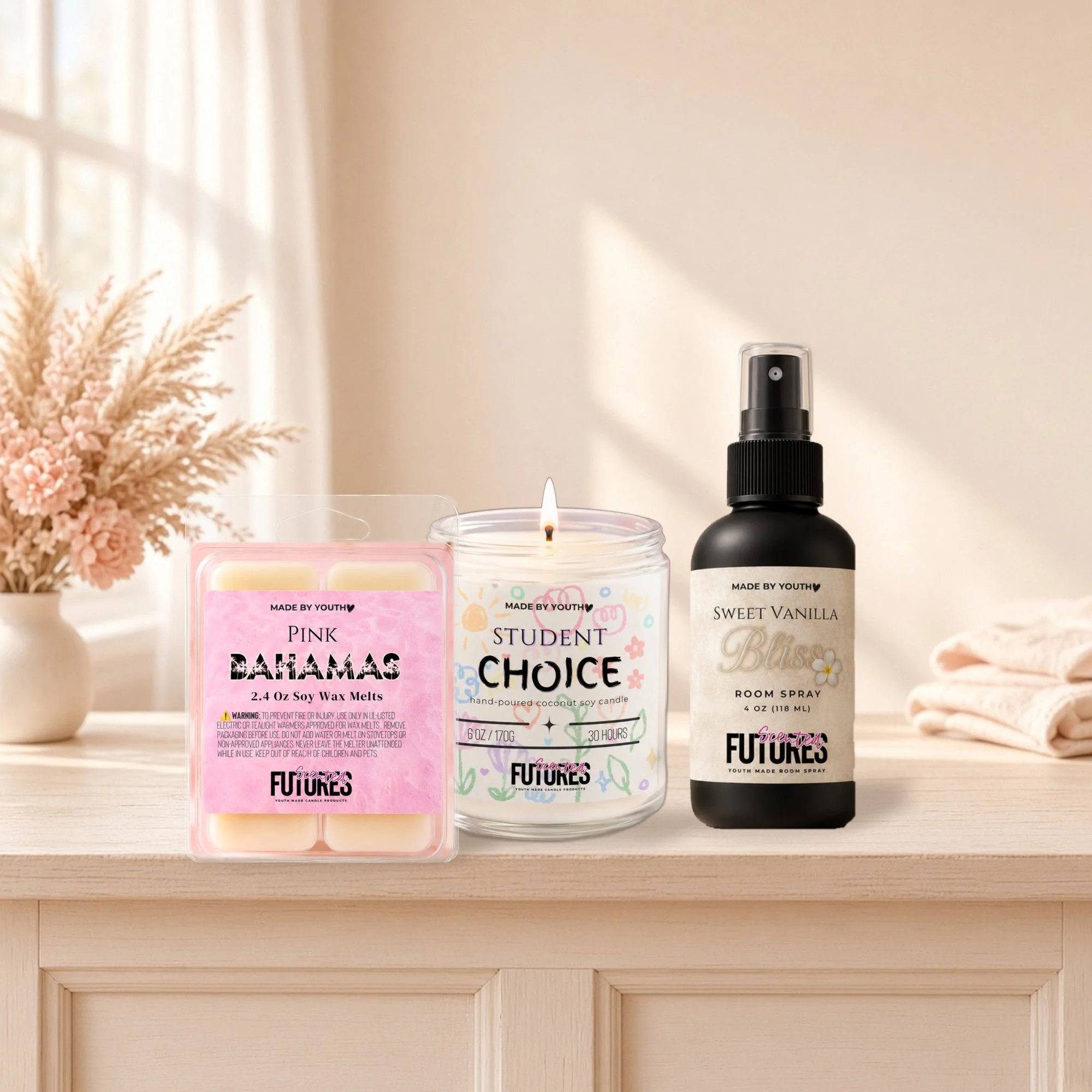 Scented Futures Gift Bundle candle, wax melts and room spray on a table