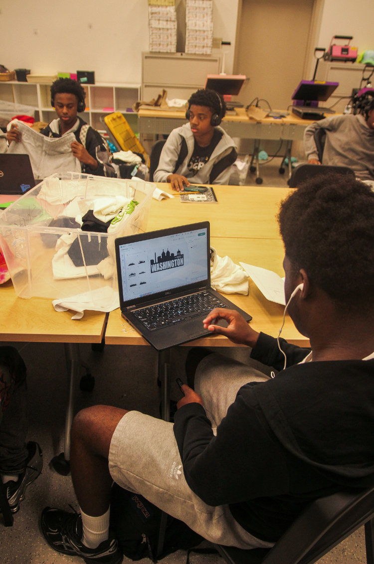 Youth creating apparel and design products at YEI