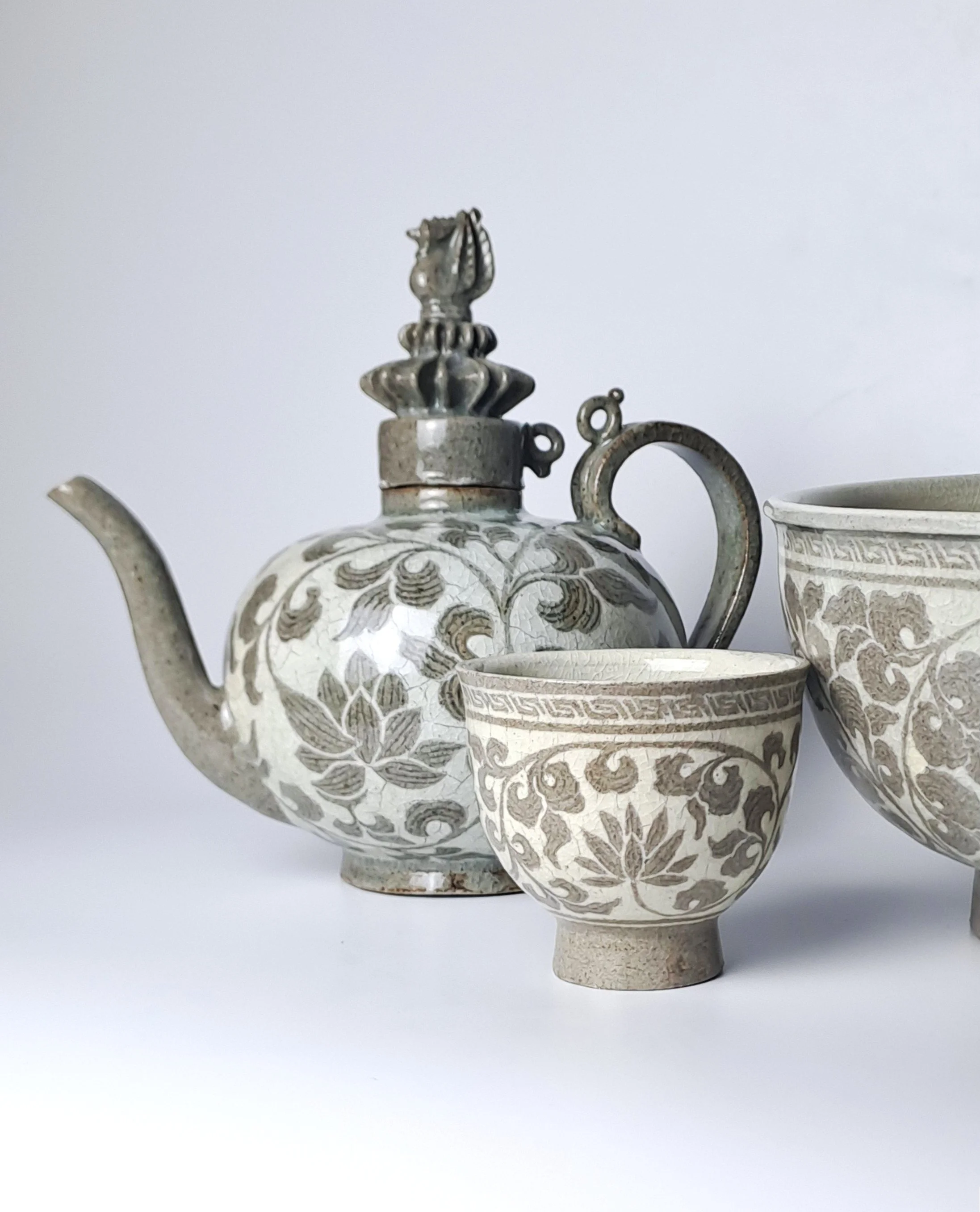 Celadon Ewer, Tea Cup, and Dish with Inlaid Lotus Scroll Design / 
Wood-fired, 2025
