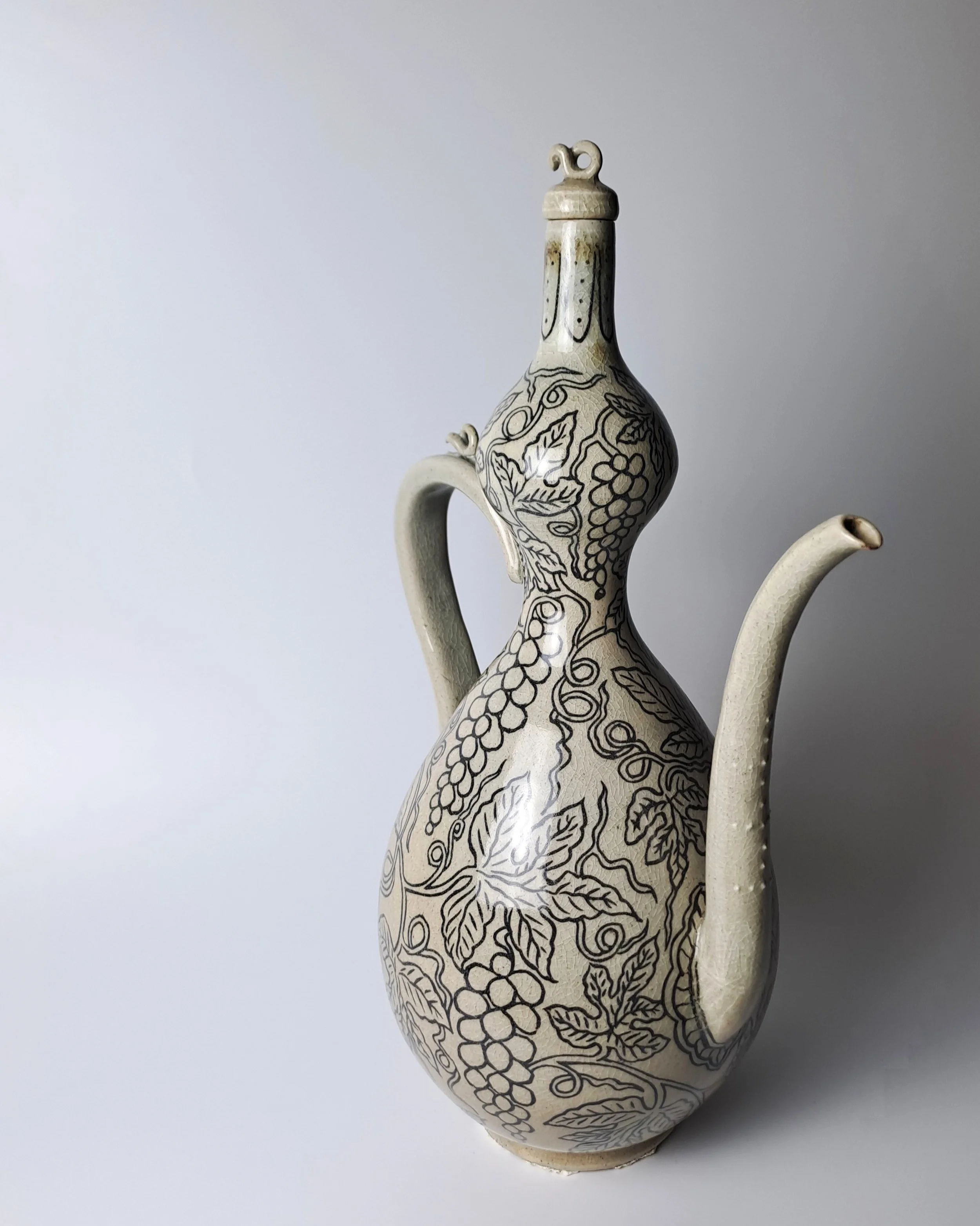 Celadon Gourd-shaped Ewer with Inlaid Grape Design
/Wood-fired
