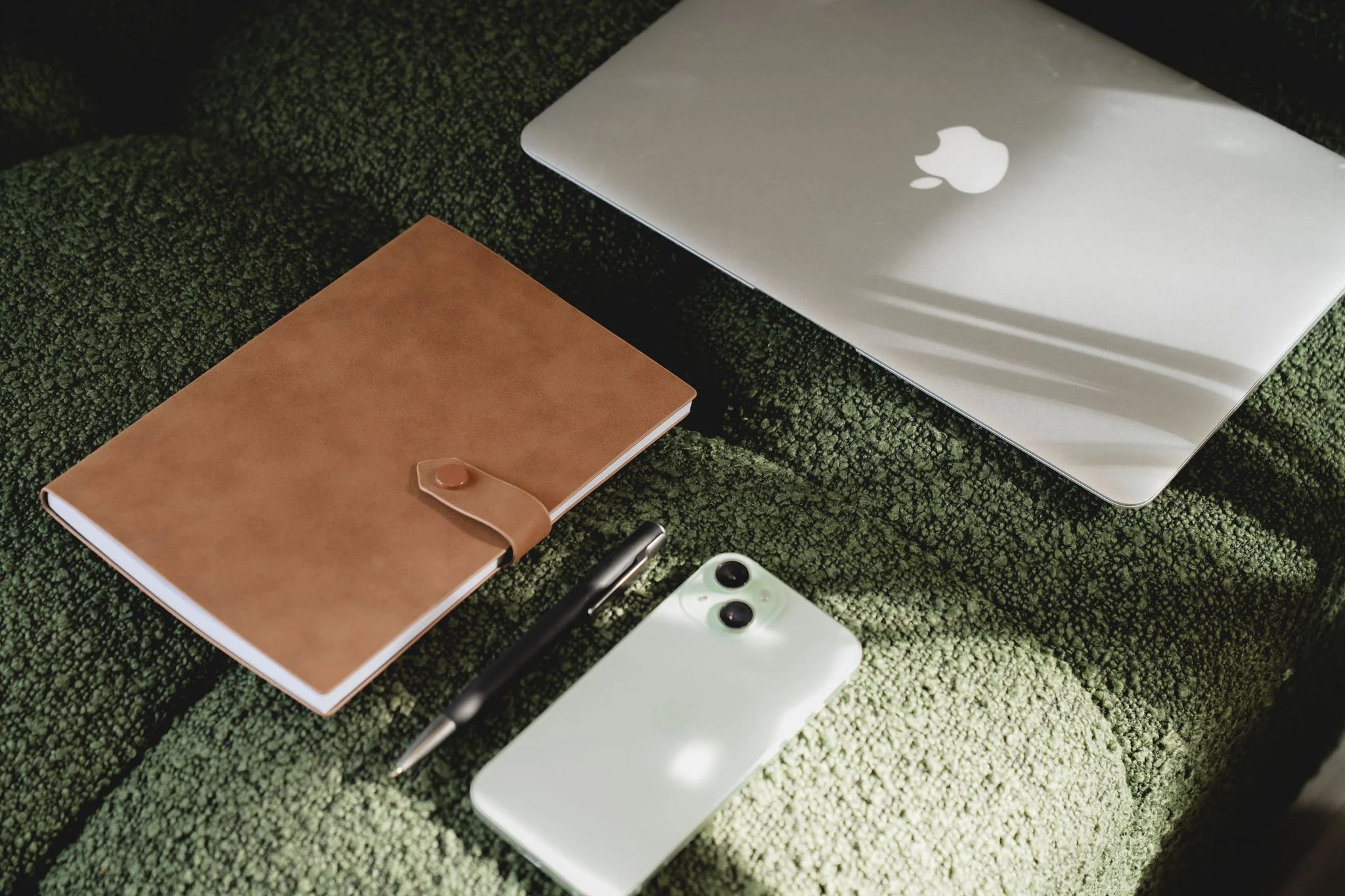 Laptop and notebook set up for marketing planning