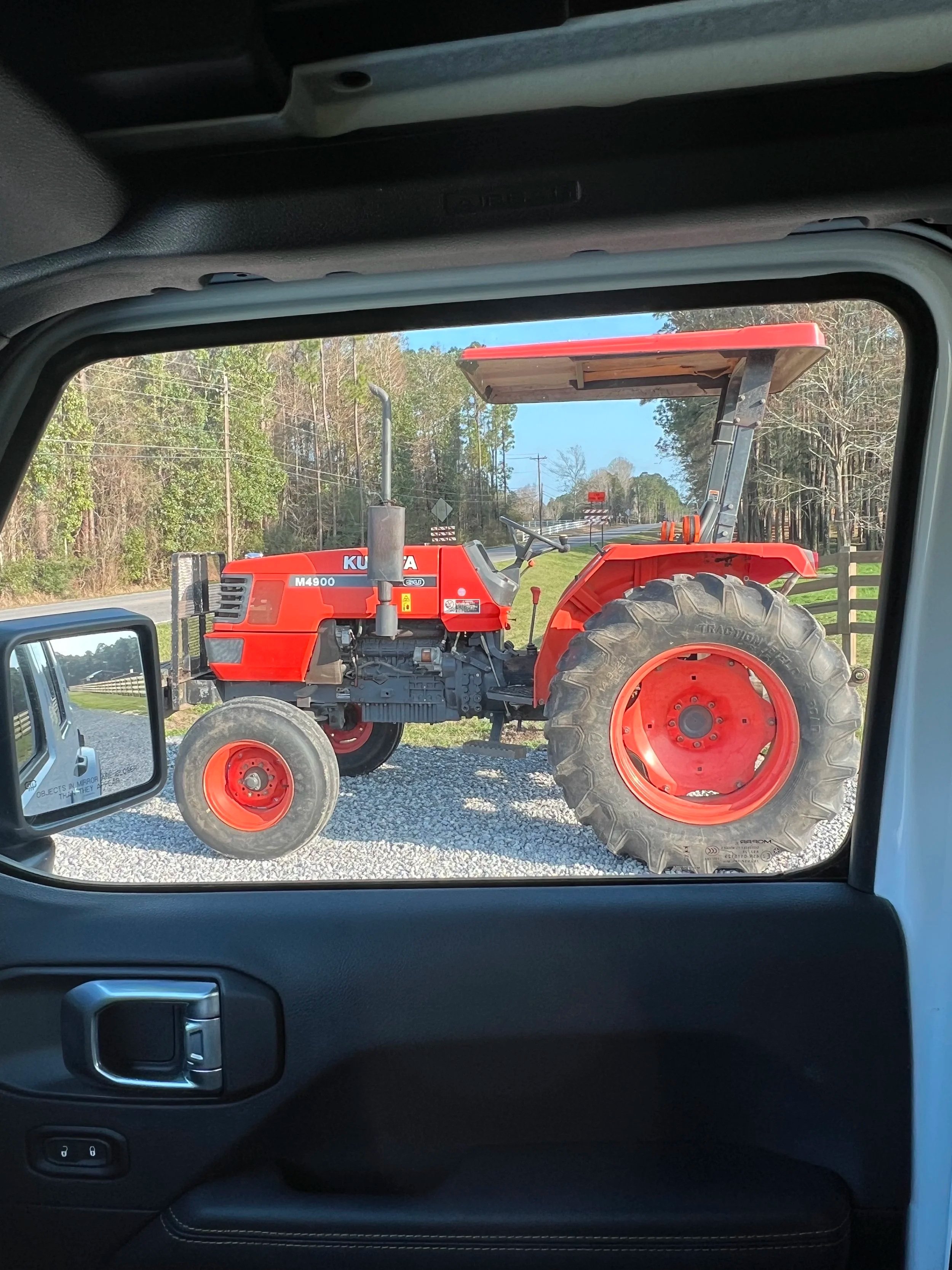 Our first farm equipment purchase! Kubota M4900! Nice and easy for women to operate, and I love the sun cover. It's fun to cut the pasture, but beware the ant piles, then tend to create mini dust poofs.
